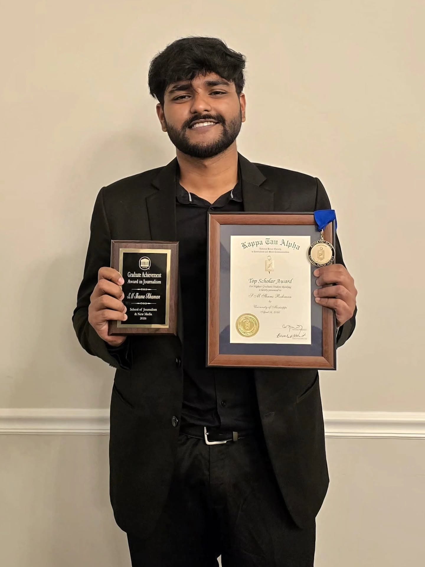 Shams Rahman receiving award